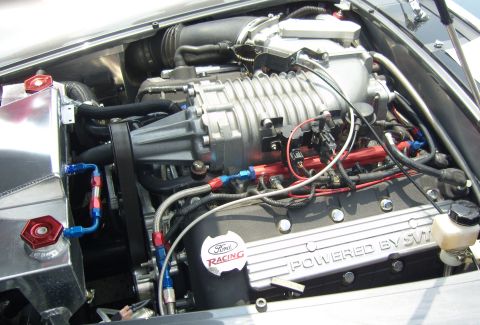 2007 Ford Mustang - This engine features a prominent supercharger and custom racing components.
