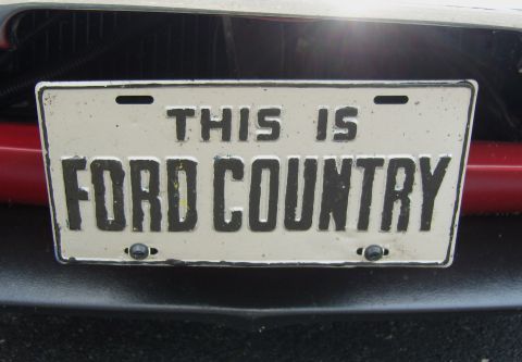 2007 Ford Mustang - A custom license plate with the words 'THIS IS FORD COUNTRY' is attached to the front of a vehicle.