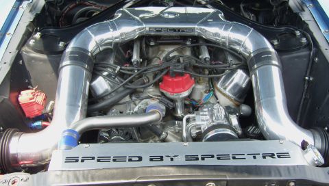 2007 Ford Mustang - The engine bay shows custom chrome intake pipes and a "SPEED BY SPECTRE" plate.