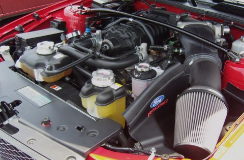 2007 Ford Mustang - The engine bay features a Ford Racing air intake system and a supercharger, indicating performance modifications.