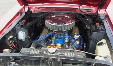 2007 Ford Mustang - Engine bay view of a Ford 302-4V V8, likely from a classic Mustang.