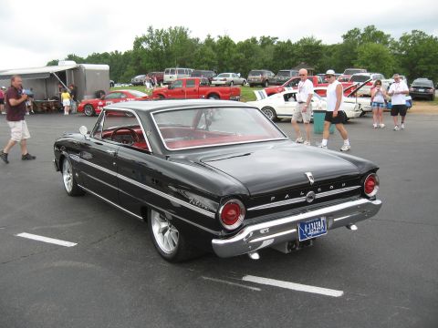 1968 Shelby GT500 - A black Ford Falcon is parked at an outdoor car show. The license plate reads '4-13434'.