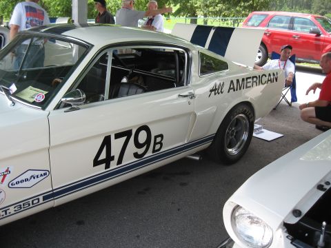 1968 Shelby GT500 - Side view of a 1967 Shelby GT350 race car, number 479B, with 'All AMERICAN' text on the quarter panel.