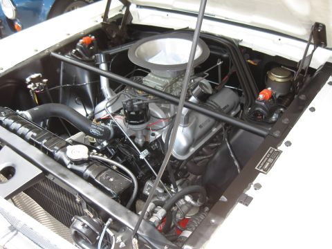 1968 Shelby GT500 - Close-up view of a classic car's engine compartment, highlighting the V8 engine and its components.