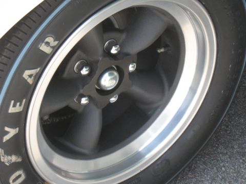 1968 Shelby GT500 - A close-up view of a vehicle's wheel and tire, showing the tread and sidewall details.
