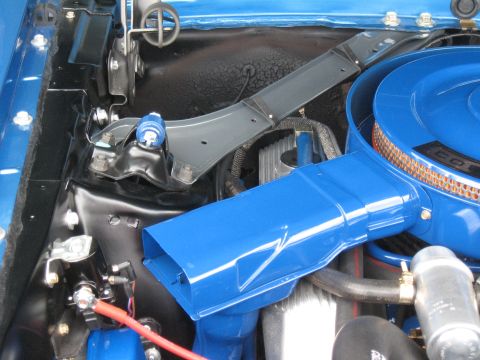 1968 Shelby GT500 - Close-up of engine bay components, focusing on a bright blue air intake system.
