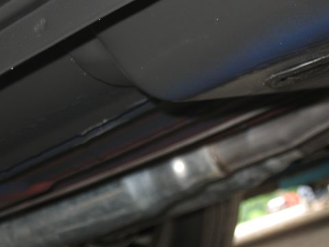 1968 Shelby GT500 - Close-up of the underbody structure and exhaust system of a vehicle.