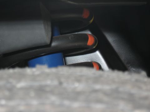 1968 Shelby GT500 - Detail shot of suspension components, including springs and a shock absorber, with visible orange markings.