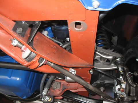 1968 Shelby GT500 - Close-up view of the undercarriage of a vehicle, revealing suspension and brake system components.