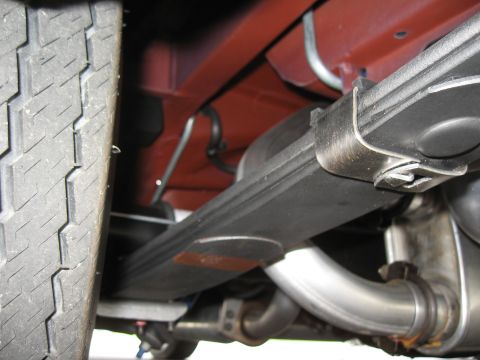 1968 Shelby GT500 - Undercarriage view showing the leaf spring and exhaust system, with 'SUPERMOTORS.NET' visible.