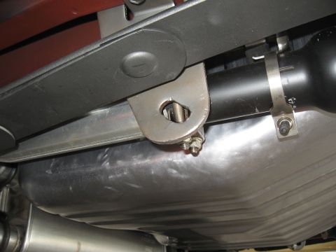 1968 Shelby GT500 - Close-up of a car's fuel tank and exhaust system, showing suspension linkage.