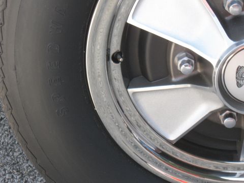 1968 Shelby GT500 - A close-up view of a vehicle's wheel and tire, showing the "SPEEDWAY" branding on the tire sidewall.