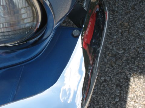 1968 Shelby GT500 - Chrome bumper and headlight trim detail on a blue vehicle.