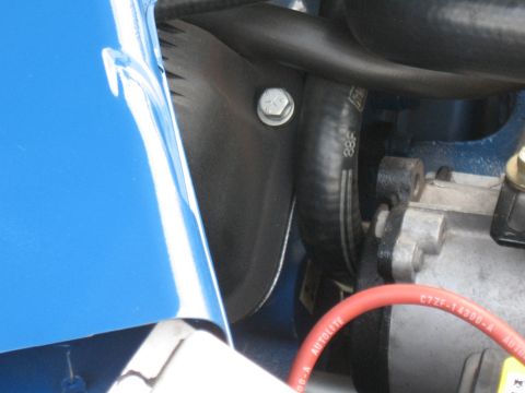 1968 Shelby GT500 - Close-up of engine bay components, including a blue fender and an Autolite spark plug wire, with Supermotors.net watermark.