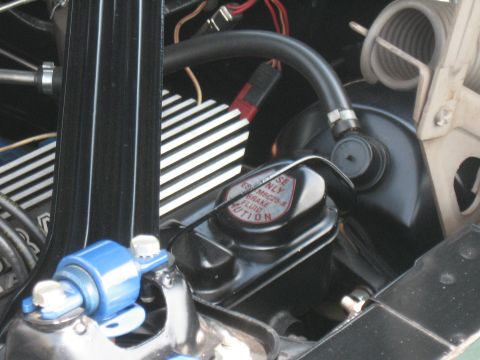 1968 Shelby GT500 - Close-up of a vehicle's engine bay, focusing on the brake fluid reservoir and associated components.