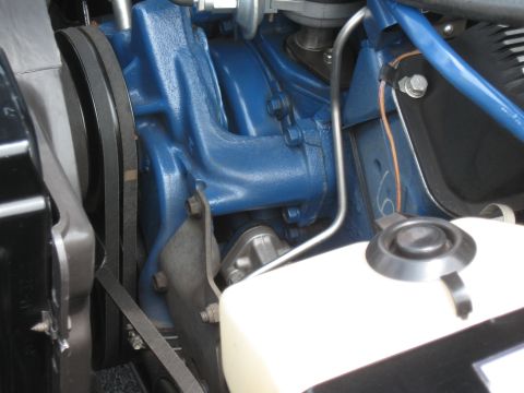 1968 Shelby GT500 - Engine bay detail showing belts and fluid reservoir.