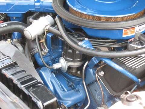 1968 Shelby GT500 - Close-up of the engine bay of a 1968 Shelby GT500, highlighting the blue Ford Cobra Jet engine and Autolite components.