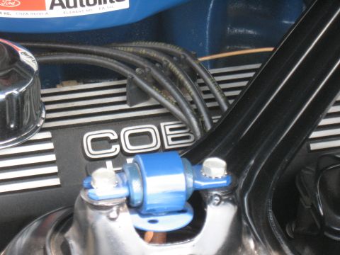1968 Shelby GT500 - Detail shot of a Ford Cobra engine, showing the 'COBRA' lettering on the valve cover.