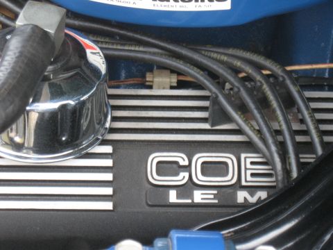 1968 Shelby GT500 - Engine valve cover with COBRA LE M markings, part of a vehicle's engine.