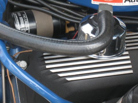 1968 Shelby GT500 - Close-up of the engine bay of a 1968 Shelby GT500, showing various components and blue hoses.