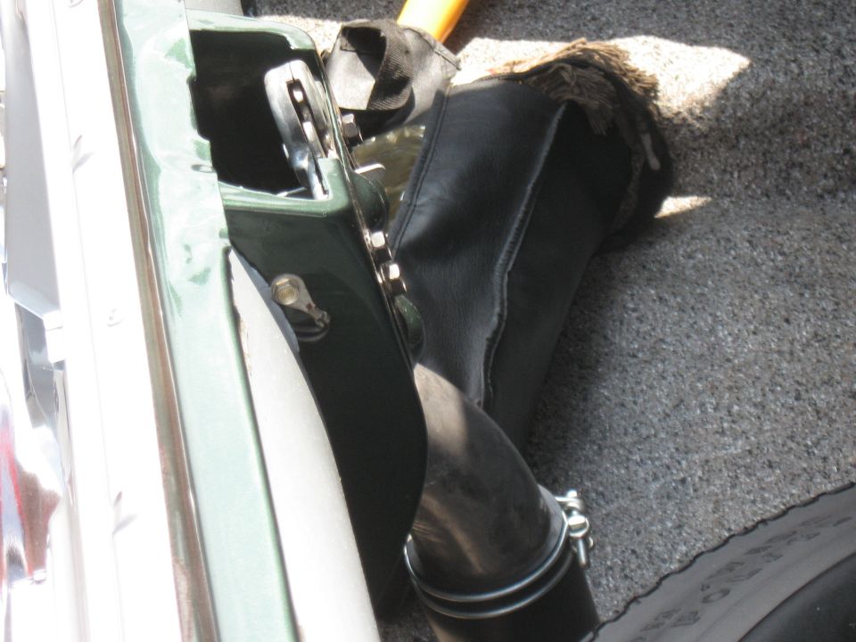 Engine intake hose and green fender detail