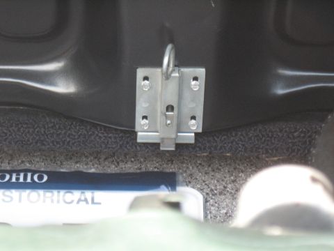 1968 Shelby GT500 - A metal latch mechanism is visible in the trunk of a vehicle, with a partial view of an Ohio Historical Society label.