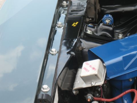 1968 Shelby GT500 - Engine bay details with visible text on a component, but no clear year identification.