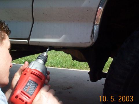 1992 Ford Bronco - Once the mount was ground off we had to drill a hole further up to mount another bolt. Since you have some exposed steel here, take the tim…