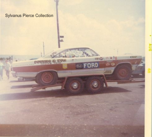 White vintage Ford drag race coupe on tandem trailer, side view
