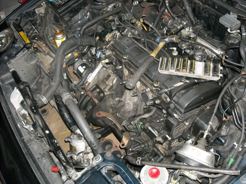 Engine bay with tools on valve cover