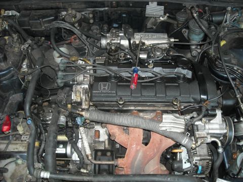 1979 Ford F-150 - A close-up view of a Honda engine bay, showing various components and wiring.