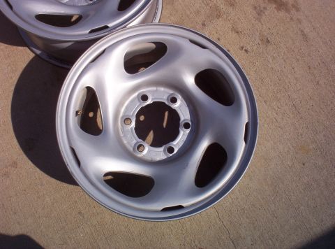 1988 Ford Bronco - Close-up of a single steel wheel rim, part of a set.