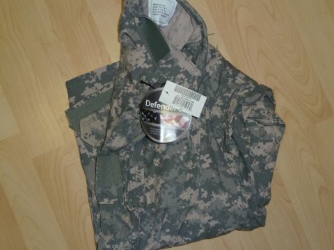 1992 Ford Mustang - Military camouflage jacket with tags visible on a wooden surface.