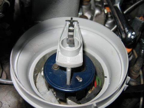 1992 Ford Bronco - Distributor cap and rotor assembly, likely from a Ford vehicle, with visible part markings.