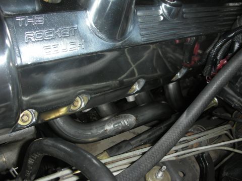 1992 Ford Crown Victoria - Close-up of engine components, including a polished valve cover and exhaust headers.