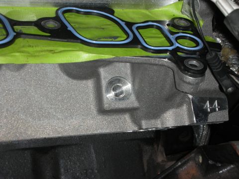 1992 Ford Crown Victoria - Close-up of an engine component with gasket material and a bolt visible, marked with the number 44.