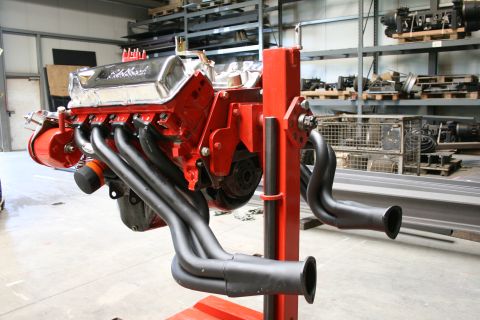 1973 Ford Ranchero - V8 engine on a stand with headers, likely for a classic car restoration project.