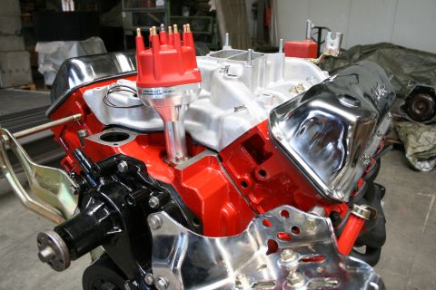 1973 Ford Ranchero - A V8 engine with chrome accents and a red distributor is shown, with a watermark for SuperMotors.net.