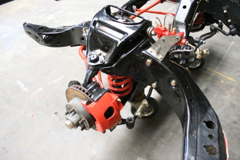 1973 Ford Ranchero - Close-up of a vehicle's chassis and suspension system during a rebuild.