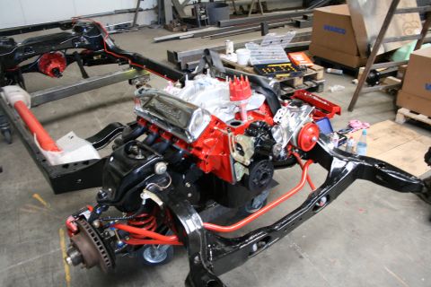 1973 Ford Ranchero - Engine and chassis assembly undergoing restoration or rebuild in a workshop environment.