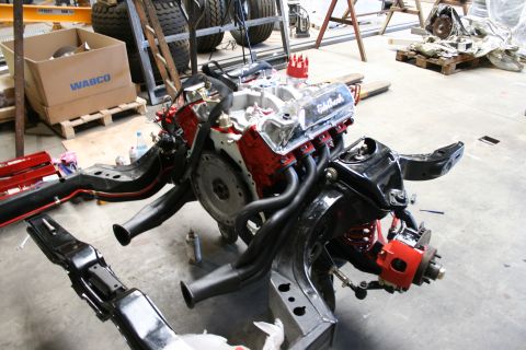 1973 Ford Ranchero - Engine and chassis components are disassembled and laid out in a workshop.