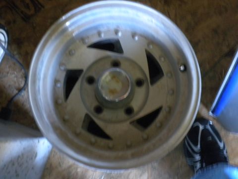 1989 Ford Bronco - Close-up of a single aluminum alloy wheel, showing its spoke design and central hub.