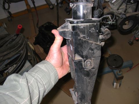 1993 Ford Taurus - A hand holds up a black plastic automatic transmission dipstick tube and filler housing with molded "FULL HOT" and "FULL COLD" level markin…