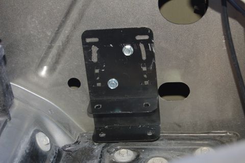 2007 Chevrolet Silverado 1500 - Close-up of a metal bracket installation on a vehicle's chassis.