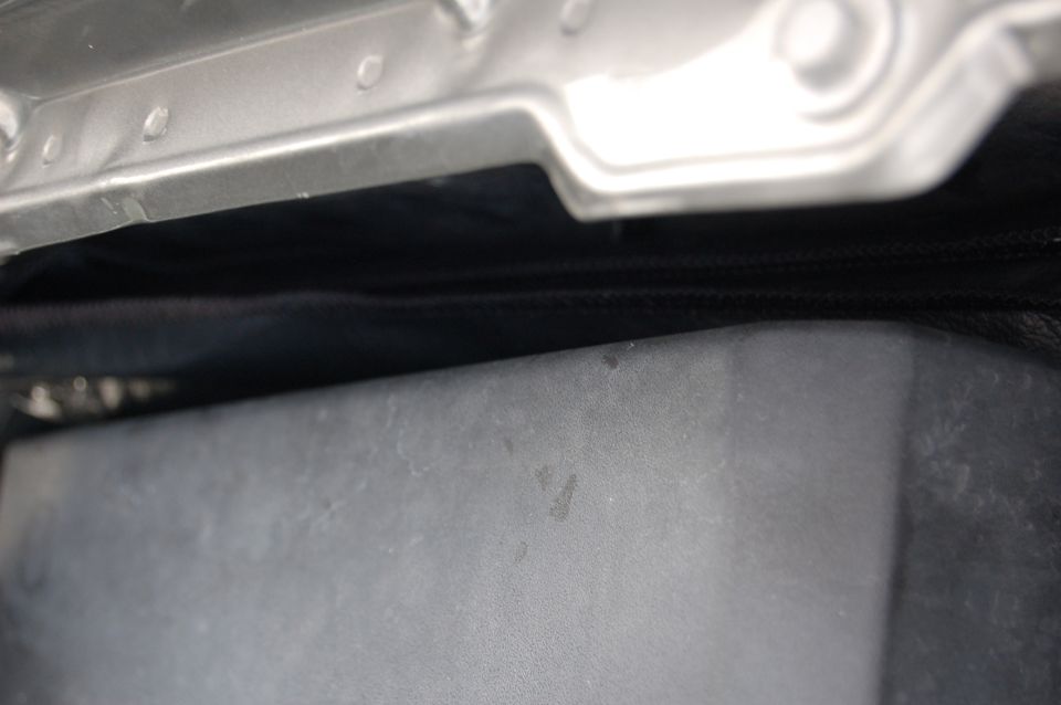 Close-up of engine bay components, possibly under the hood of a vehicle