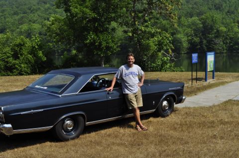 1965 Ford Galaxie - Man poses with his 1965 Ford Galaxie coupe by a lake.