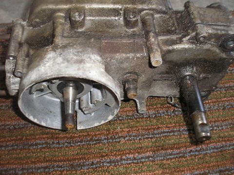 1981 Garelli Rally Sport - Close-up of a greasy engine component, possibly a transmission or gearbox, with visible shafts and mounting points. The SuperMotors.net log…