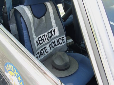 2007 Ford Mustang - A Kentucky State Police vest and hat are placed on the passenger seat of a vehicle.