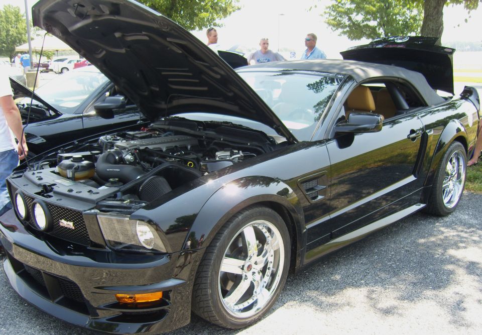 Black 2007 Ford Mustang convertible with hood open, tan interior, chrome wheels