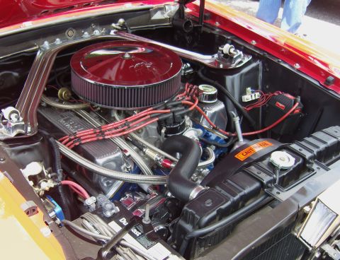 2007 Ford Mustang - Close-up view of a classic car's engine bay, a prominent air filter and various engine components.